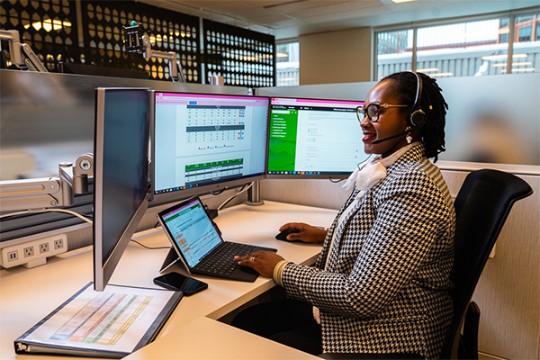 House Administration employee at workstation.